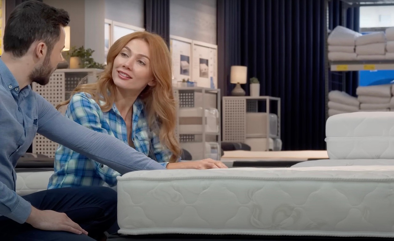 couple, mattress, shopping, husband, wife, man, woman, linens, shelves, curtain, bed, indoors, mattress, mattress, mattress, mattress, mattress, husband