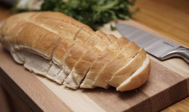 food, bread, knife, sliced bread, cutting board, italian bread, loaf, kitchen, cooking, kitchenware, wood cutting board, food, bread, cutting board, cutting board, italian bread, italian bread, italian bread, italian bread, italian bread